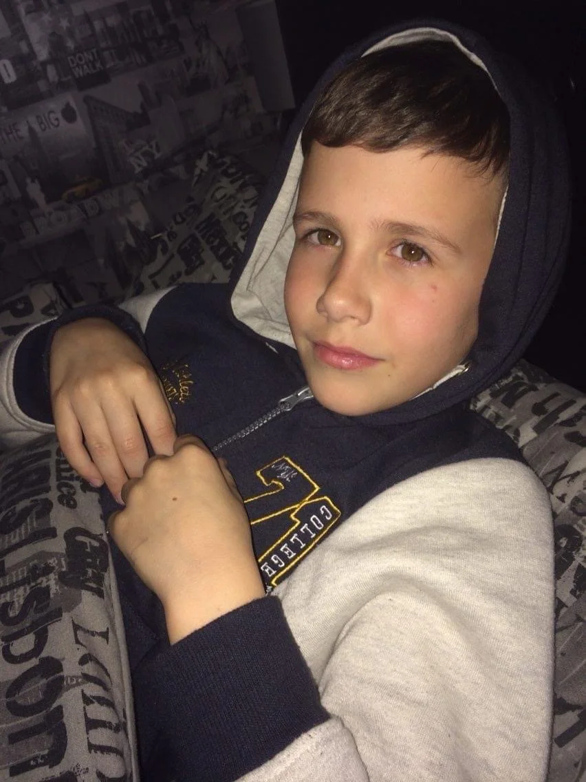 Jamie as a young boy in a hooded top.