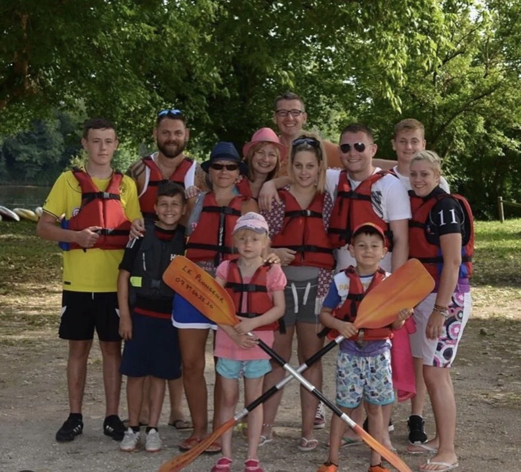 Jamie and the family in life jackets, kayaking on holiday in France.